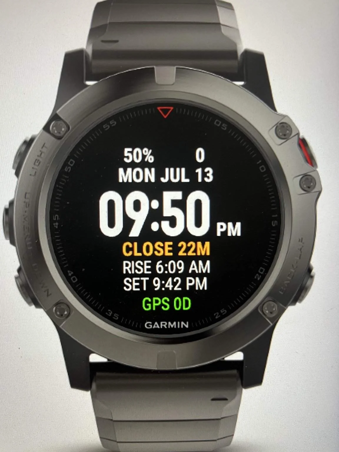 Maclyn watch face on a Garmin watch showing the time, legal light countdown, sunrise, sunset, and GPS status