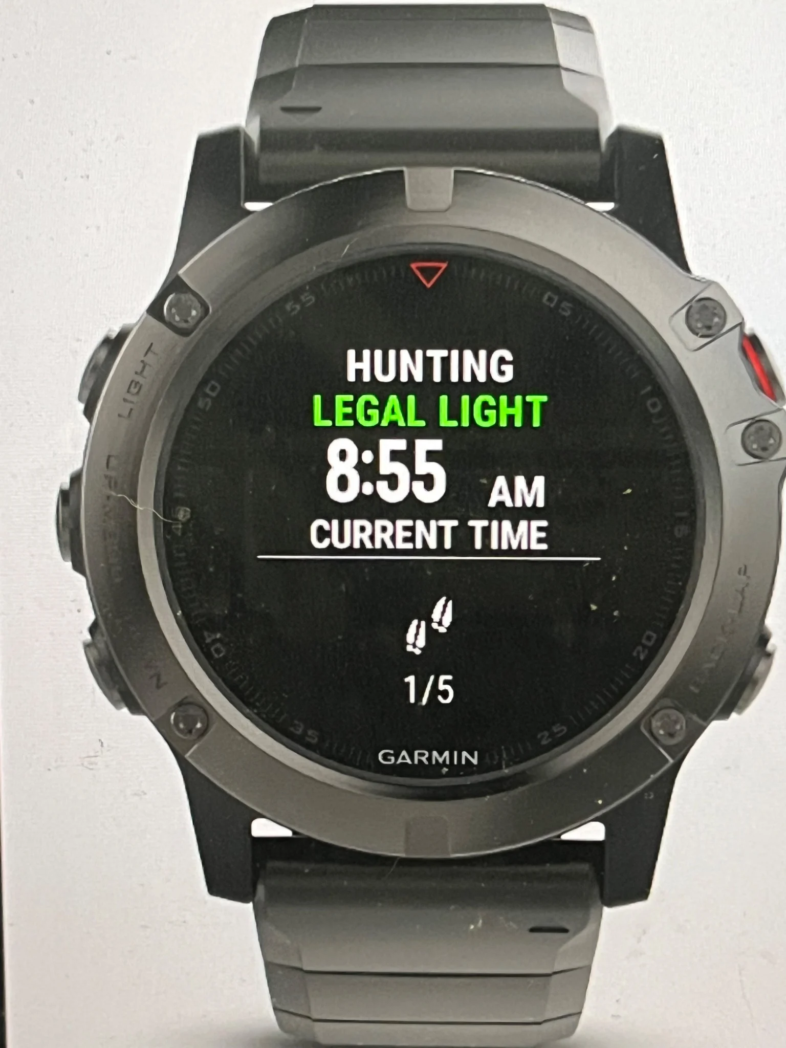 Garmin watch displaying the Maclyn Outdoor Widget with green LEGAL LIGHT and the current time